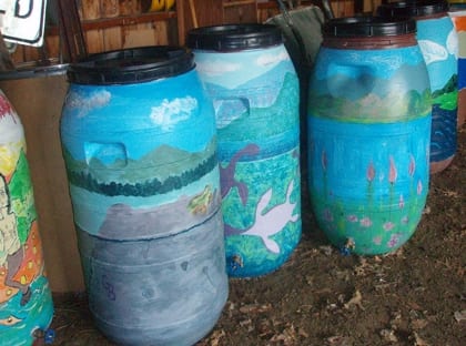 Natural Resources Conservation District rain barrels painted by local youth in Winooski, VT, are ready for residential installation. 