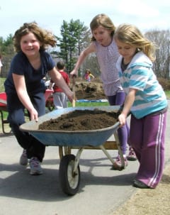First graders at Peterborough Elementary build and fill their own raised beds