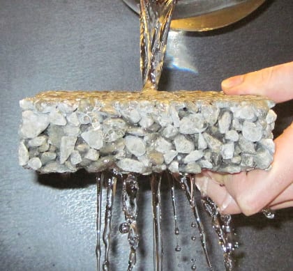 Demonstration of the porosity of a porous concrete test sample.