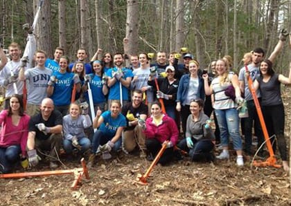 A group of students and staff from The UNH Office of the Woodlands tackle buckthorn on their semi-annual workday.